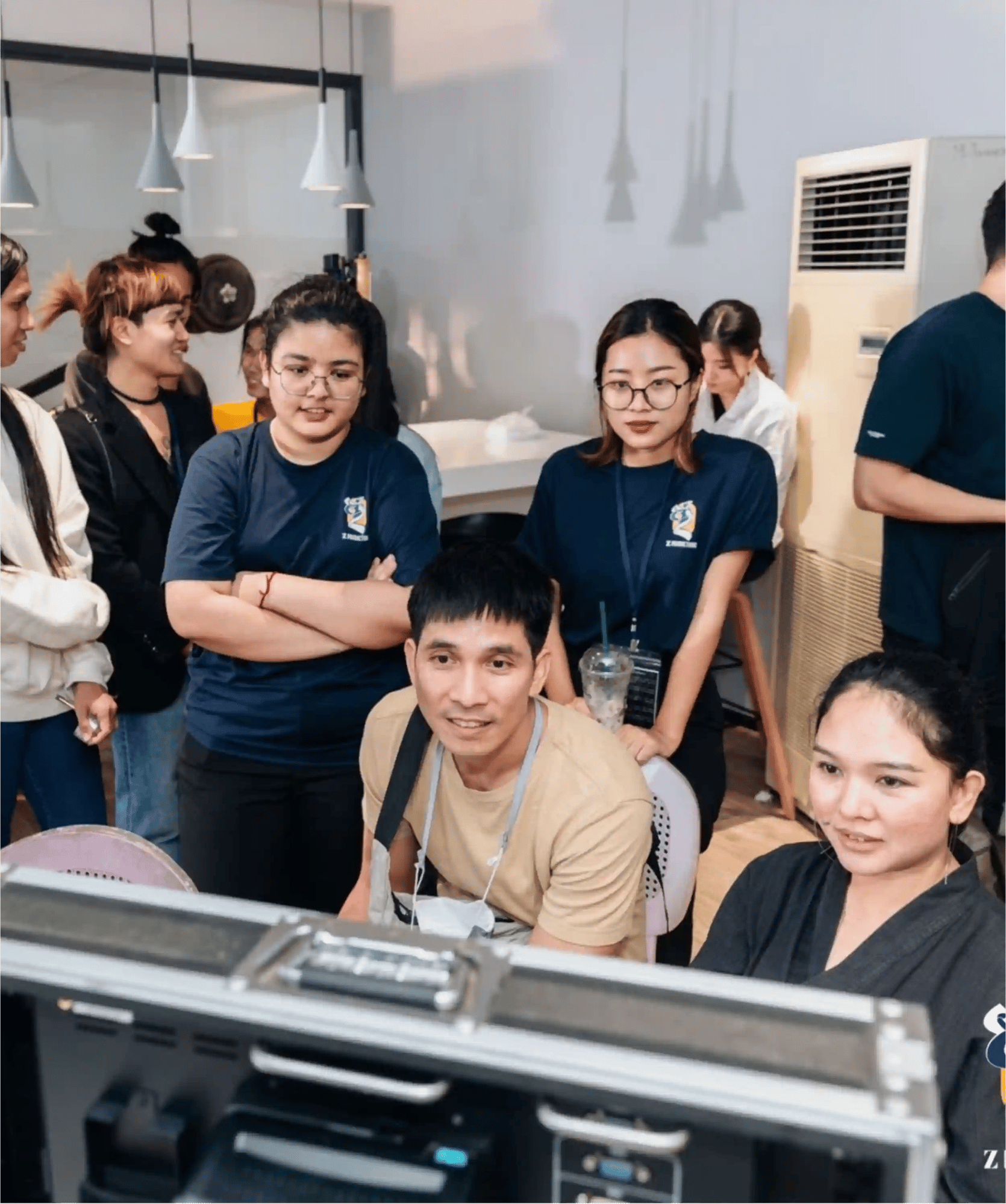 Myat overseeing a video shoot